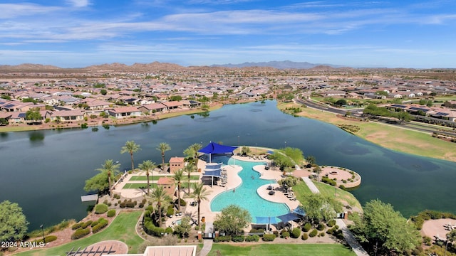 drone / aerial view featuring a water and mountain view