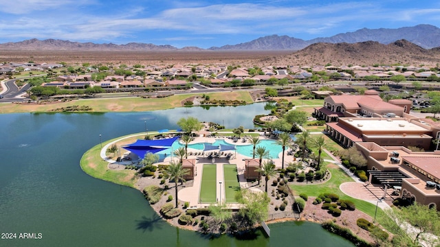 drone / aerial view with a water and mountain view