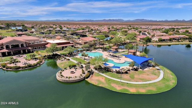 aerial view featuring a water and mountain view