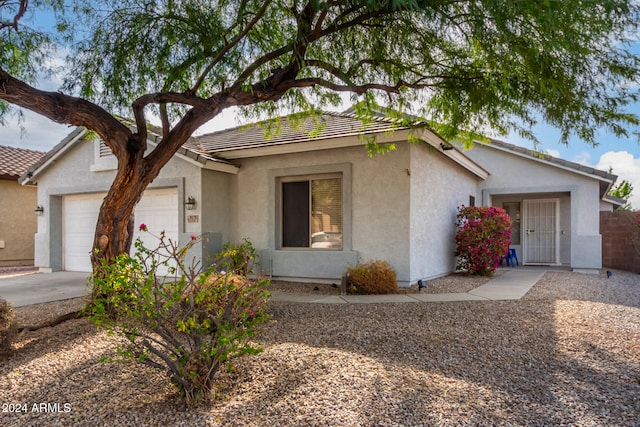 single story home with a garage