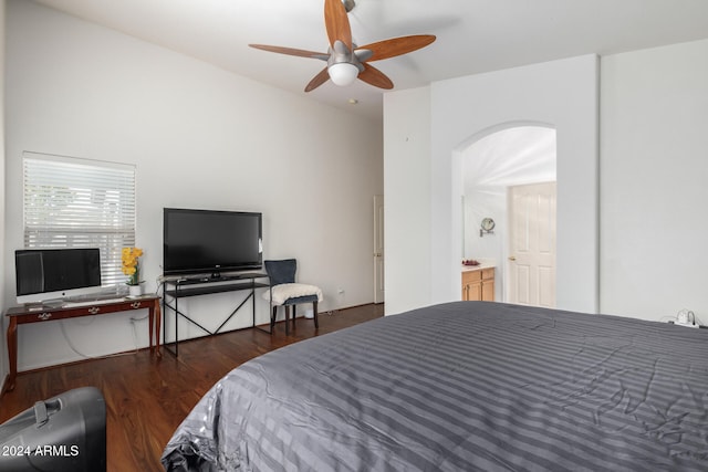 bedroom with ceiling fan, dark hardwood / wood-style floors, and connected bathroom