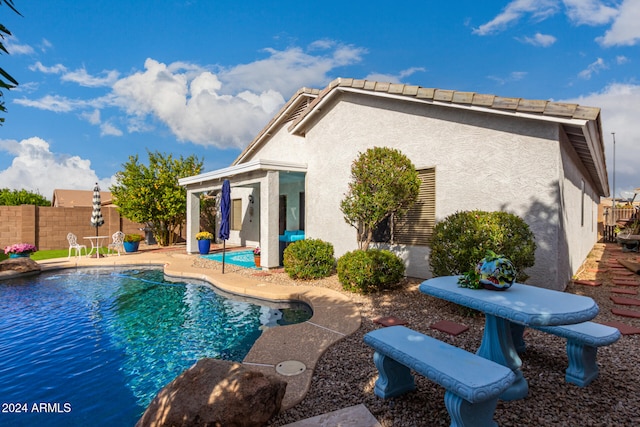 view of pool featuring a patio area