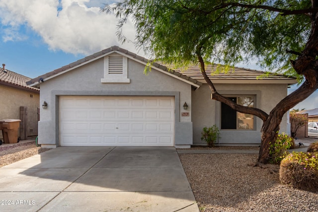 ranch-style home featuring a garage