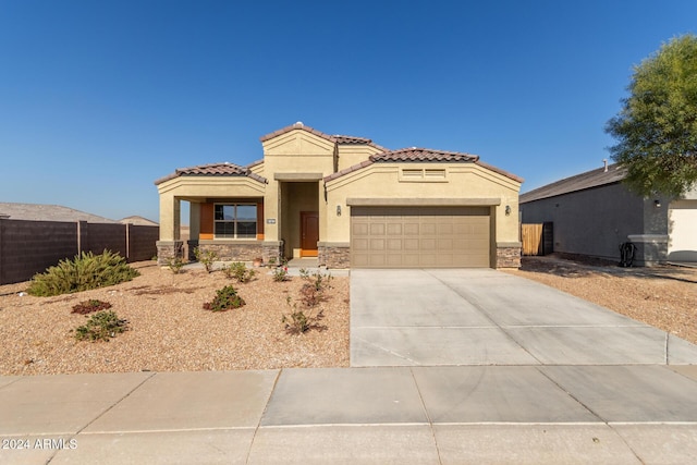 mediterranean / spanish-style house featuring a garage