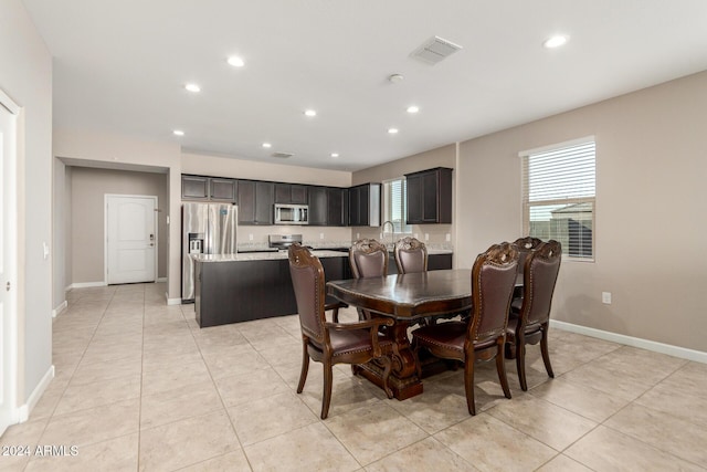 dining area featuring light tile patterned floors