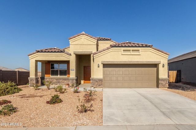 mediterranean / spanish-style house featuring a garage