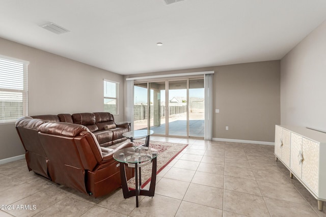 tiled living room with plenty of natural light