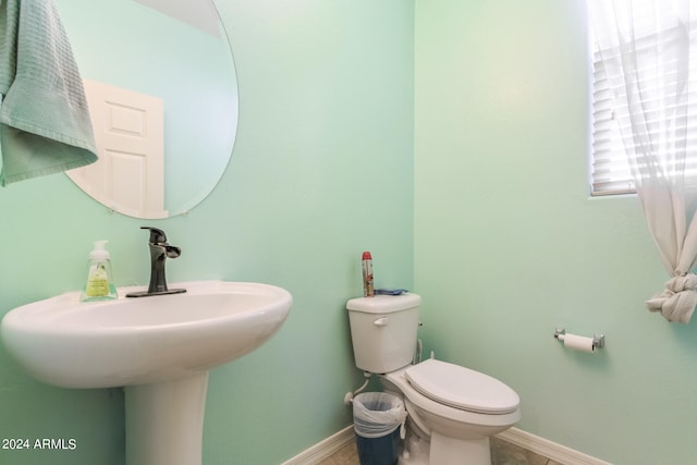 bathroom with sink and toilet