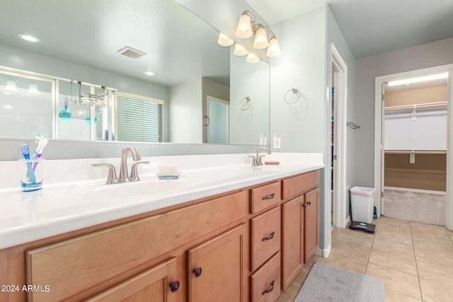 bathroom featuring tile patterned flooring and vanity