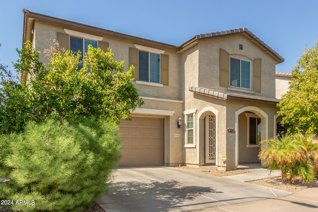 view of front of property with a garage