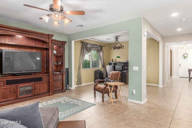 living room featuring light tile patterned flooring and ceiling fan