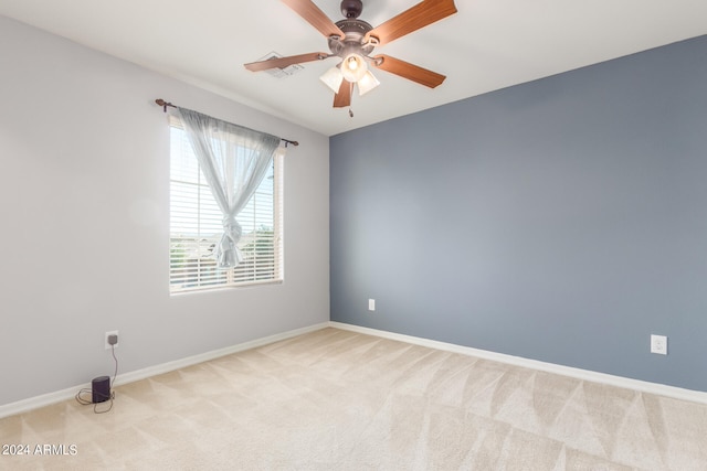 unfurnished room with light carpet and ceiling fan