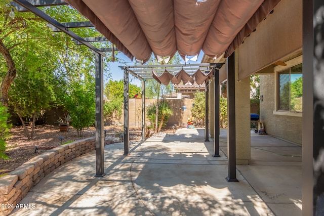 view of patio featuring a pergola