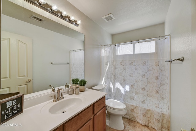 full bath featuring tile patterned floors, vanity, visible vents, and toilet