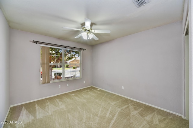 spare room featuring visible vents, ceiling fan, baseboards, and carpet floors