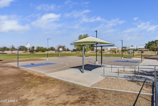 view of basketball court featuring community basketball court and a yard