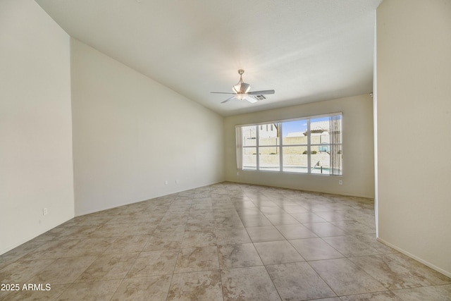 unfurnished room featuring visible vents, ceiling fan, lofted ceiling, and light tile patterned floors