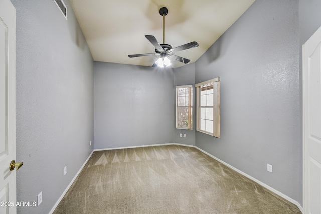 spare room featuring ceiling fan, baseboards, visible vents, and carpet floors