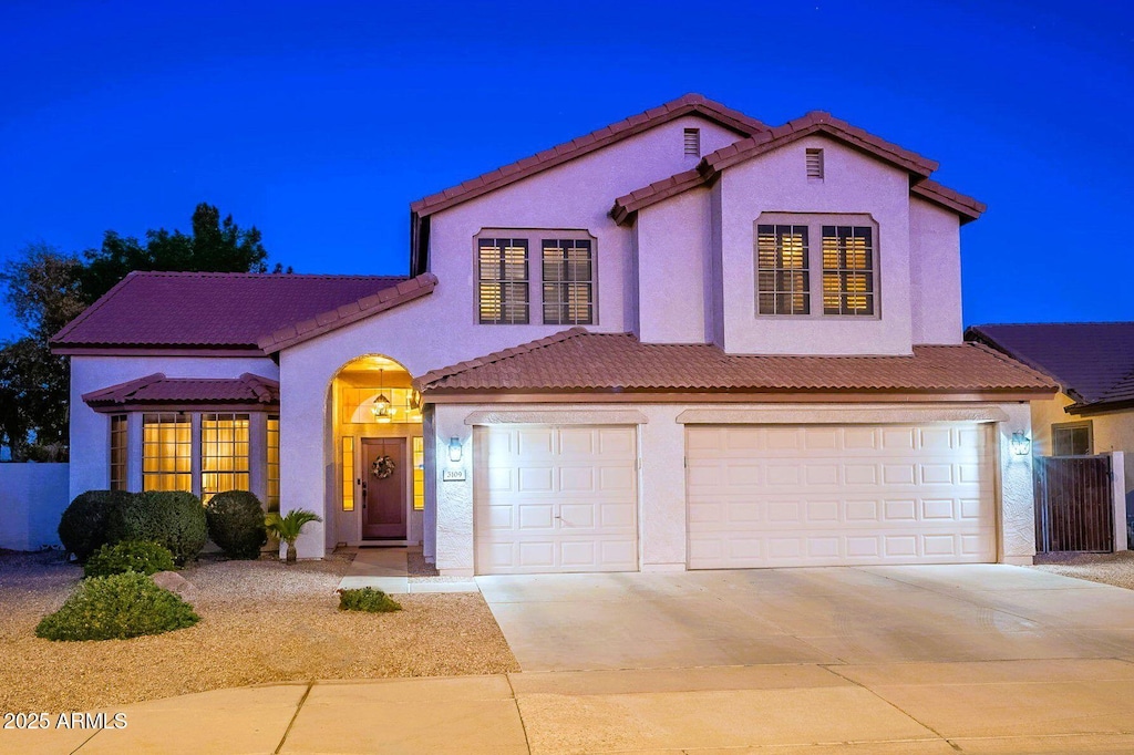 mediterranean / spanish-style home featuring a garage