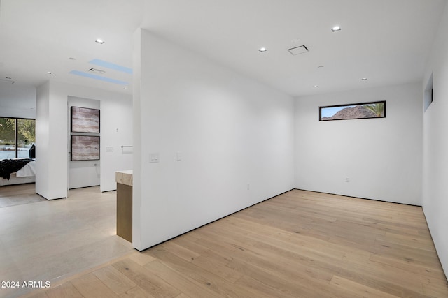 empty room with light hardwood / wood-style floors