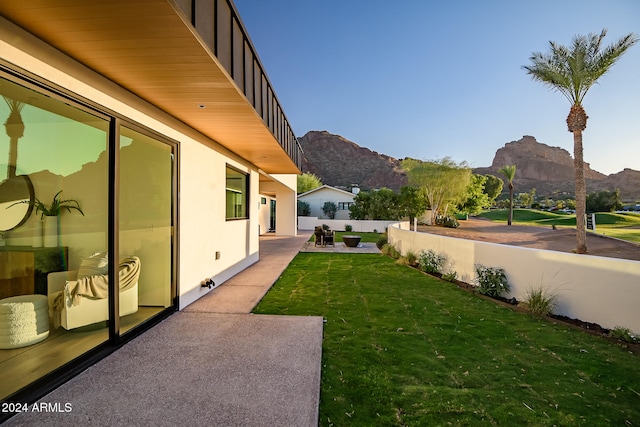 view of yard with a mountain view and a patio area