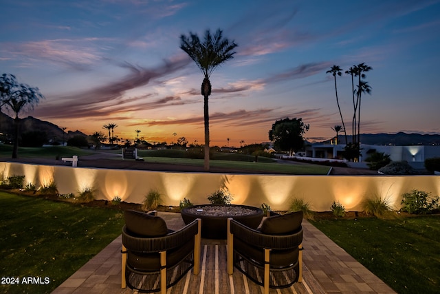 patio terrace at dusk with a lawn