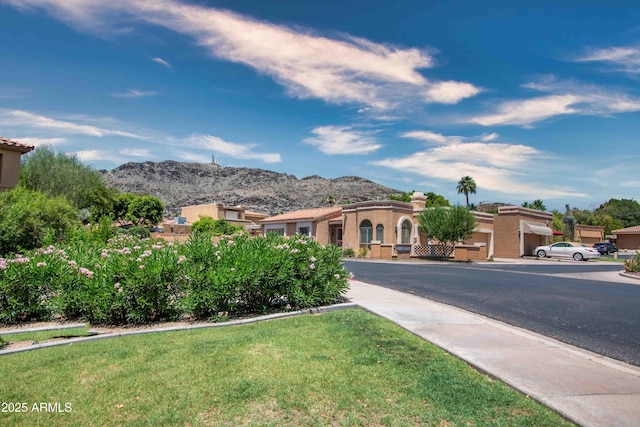 10655 N 9th St Unit 112, Phoenix, AZ 85020 - mediterranean / spanish home with a mountain view and a front yard
