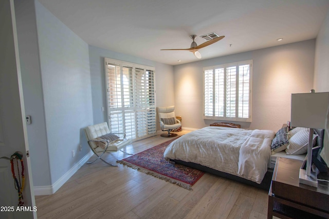 10655 N 9th St Unit 112, Phoenix, AZ 85020 - bedroom featuring multiple windows, wood finished floors, access to outside, ceiling fan, and recessed lighting