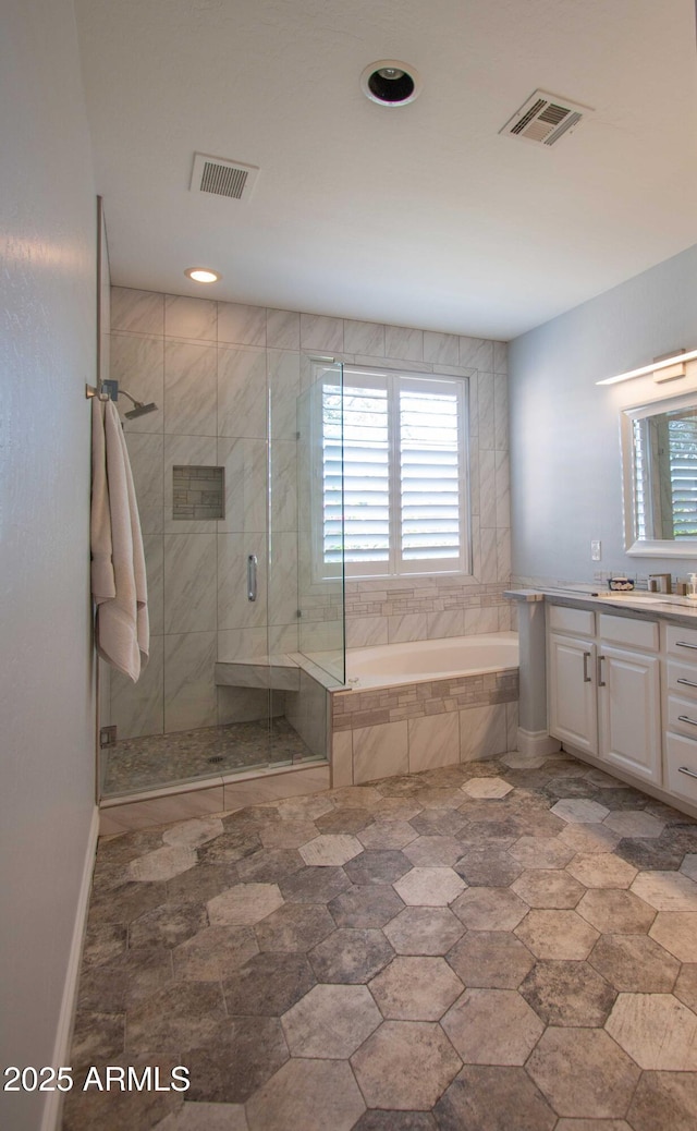 10655 N 9th St Unit 112, Phoenix, AZ 85020 - full bath with vanity, a garden tub, a stall shower, and recessed lighting
