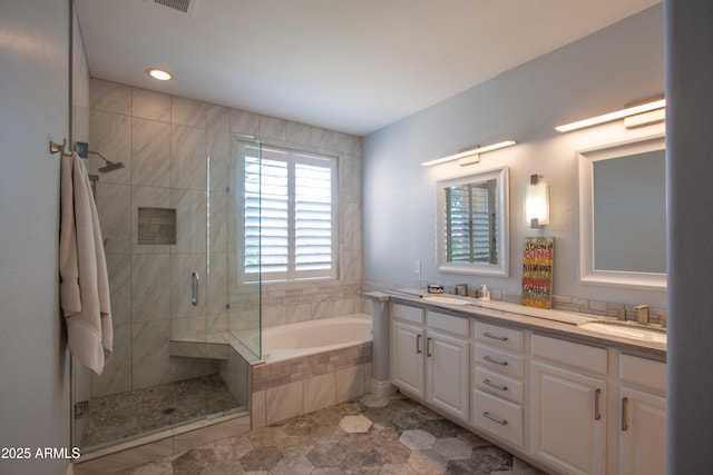 10655 N 9th St Unit 112, Phoenix, AZ 85020 - full bathroom featuring a shower stall, double vanity, and a bath