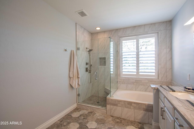10655 N 9th St Unit 112, Phoenix, AZ 85020 - bathroom with a bath, a stall shower, vanity, and recessed lighting