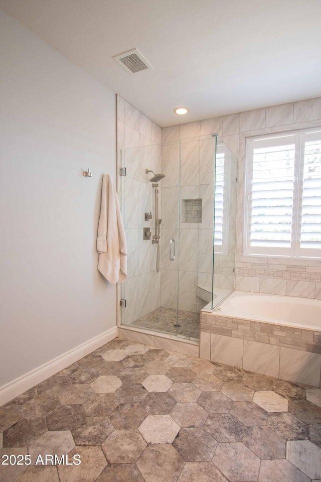 10655 N 9th St Unit 112, Phoenix, AZ 85020 - bathroom featuring a garden tub and a stall shower