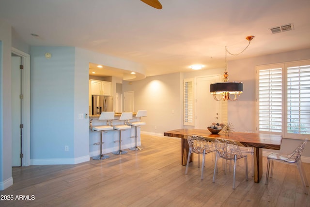 10655 N 9th St Unit 112, Phoenix, AZ 85020 - dining space featuring light wood-style floors and recessed lighting