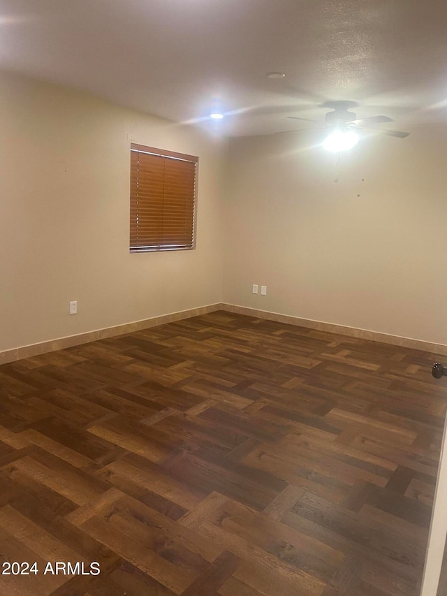 unfurnished room with dark parquet floors