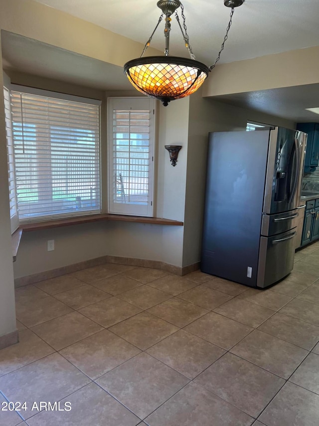 unfurnished dining area with tile patterned floors