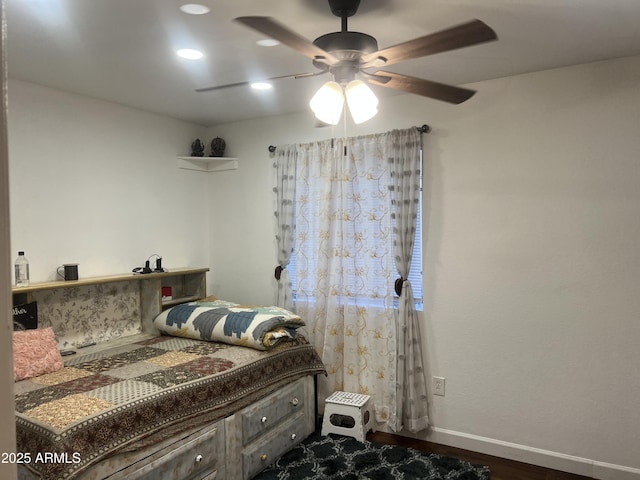 bedroom with hardwood / wood-style flooring and ceiling fan