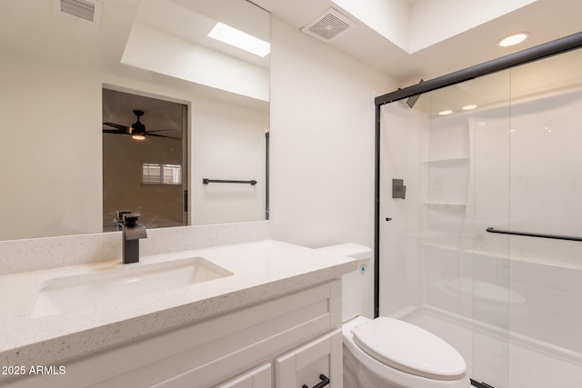 6544 N 7th Ave Unit 14, Phoenix, AZ 85013 - bathroom with vanity, a shower stall, ceiling fan, and recessed lighting