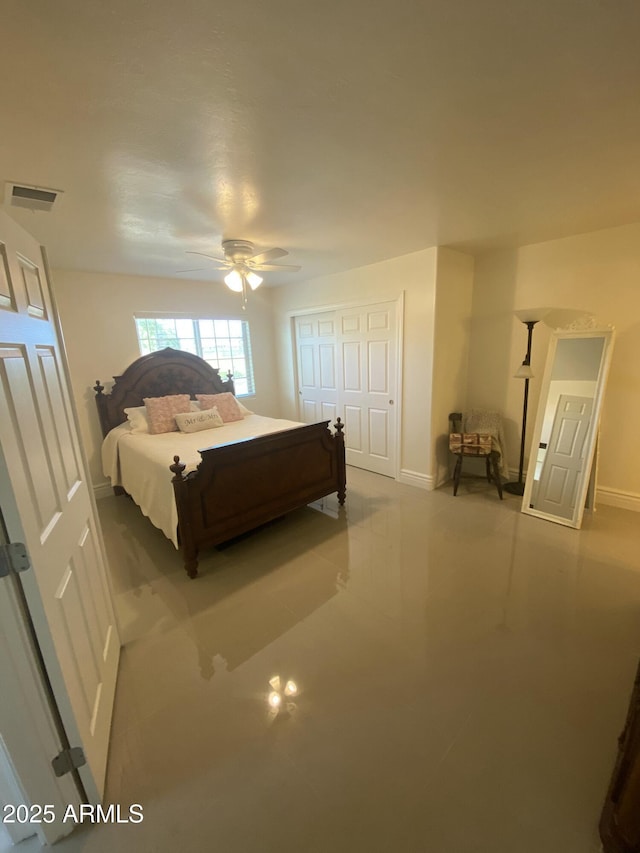 bedroom featuring baseboards, visible vents, and a ceiling fan