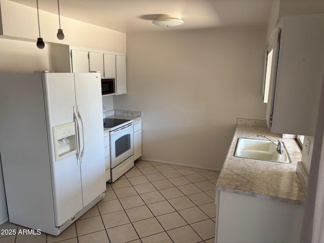 13603 N 111th Ave, Sun City, AZ 85351 - kitchen featuring white appliances, a sink, light countertops, white cabinetry, and light tile patterned floors