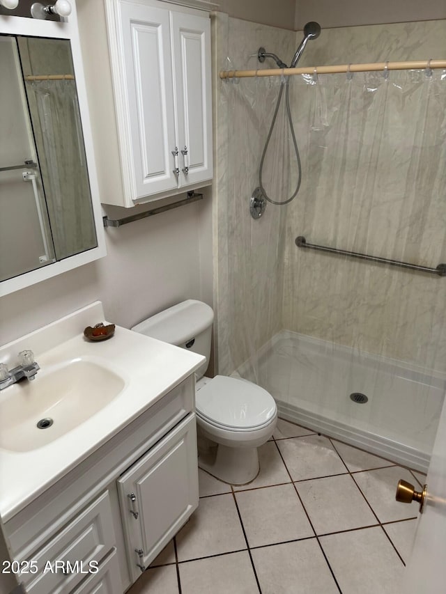 13603 N 111th Ave, Sun City, AZ 85351 - bathroom featuring a shower stall, vanity, toilet, and tile patterned flooring