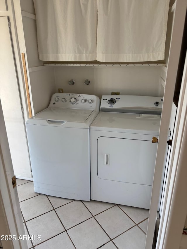 13603 N 111th Ave, Sun City, AZ 85351 - laundry room featuring cabinet space, washing machine and clothes dryer, and light tile patterned flooring