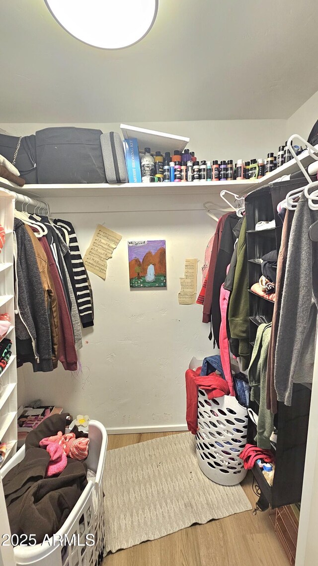 1520 W Encanto Blvd, Phoenix, AZ 85007 - walk in closet with wood finished floors