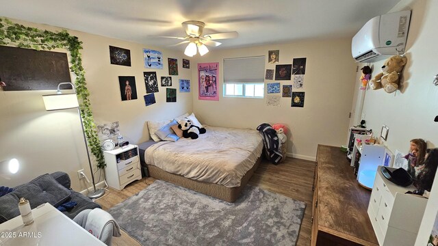1520 W Encanto Blvd, Phoenix, AZ 85007 - bedroom with an AC wall unit, baseboards, wood finished floors, and ceiling fan