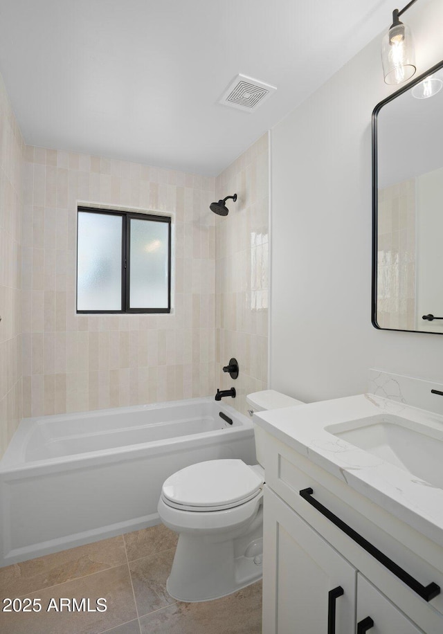 full bath featuring vanity, visible vents, bathtub / shower combination, tile patterned floors, and toilet