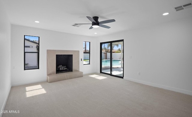 unfurnished living room with recessed lighting, visible vents, and carpet floors