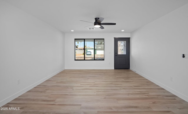 spare room with a ceiling fan, baseboards, visible vents, recessed lighting, and light wood-type flooring