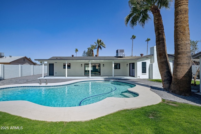 view of swimming pool with a fenced in pool, fence, central AC, and a patio area