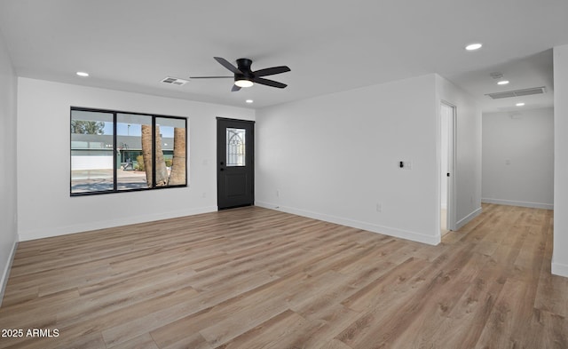 spare room featuring recessed lighting, visible vents, and light wood-style floors