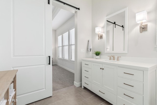 full bathroom featuring tile patterned flooring, vanity, and baseboards