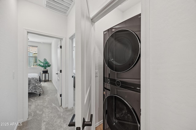 2628 S Voyager Dr Unit 104, Gilbert, AZ 85295 - laundry room featuring estacked washer and dryer and carpet floors